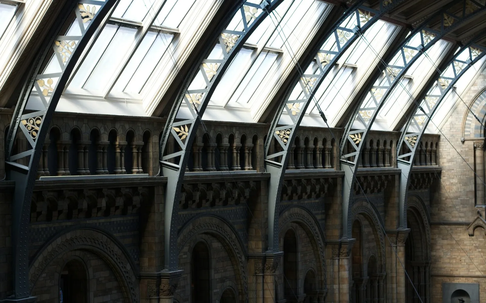 Restored stone interior with vaulted openings and skylights bringing daylight into the existing structure